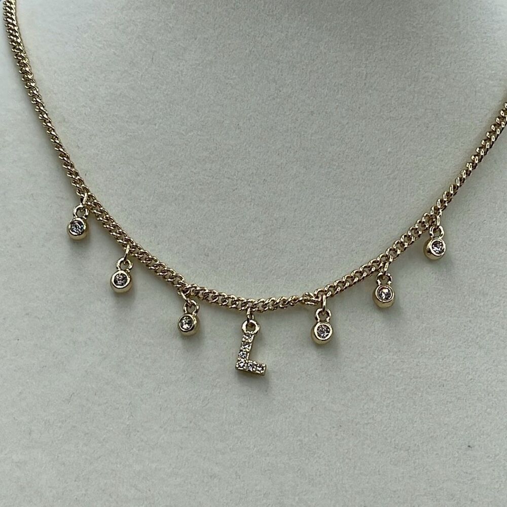 WHBM “L” dangle rhinestone gold colored choker .